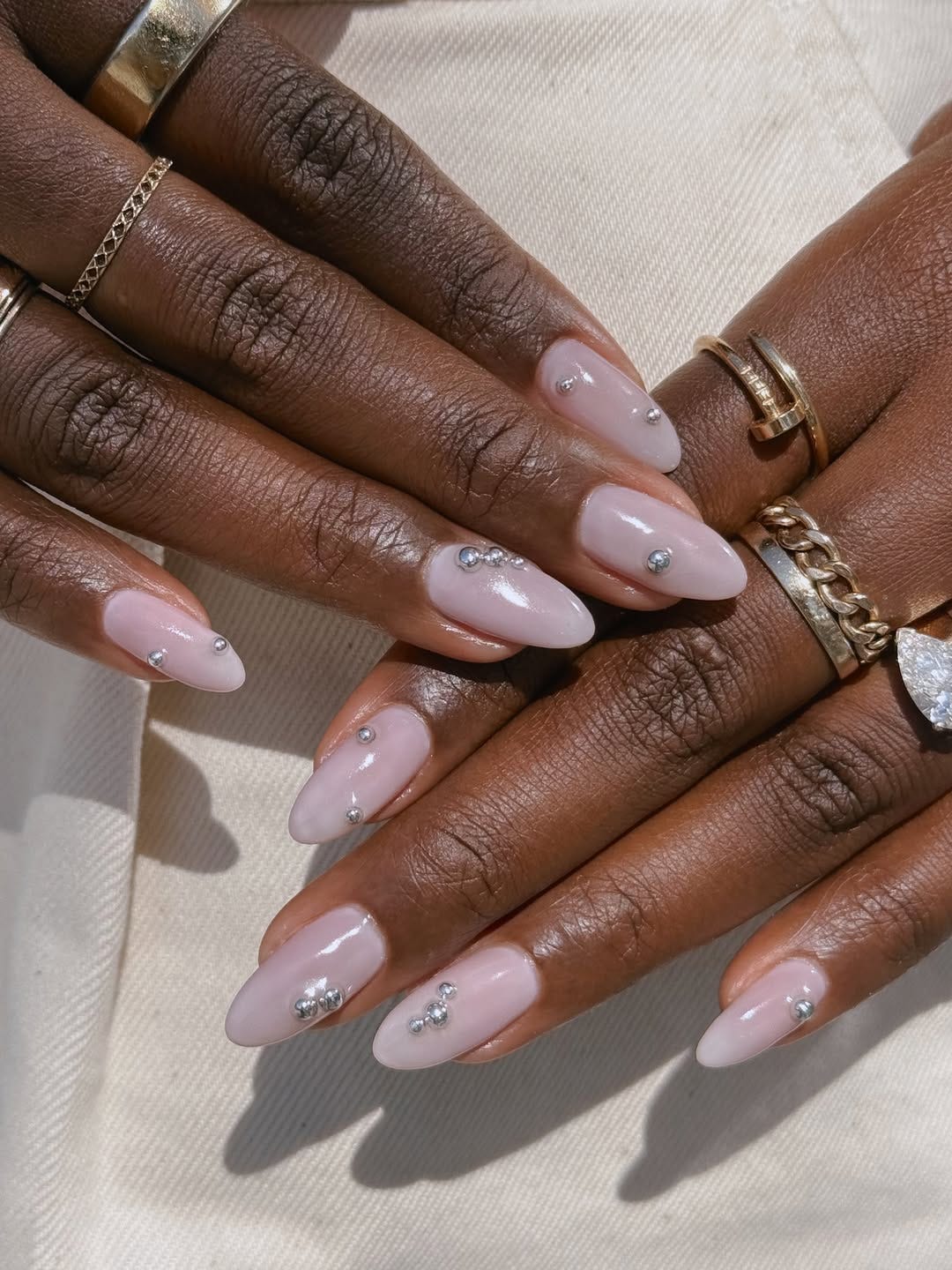 Sheer Milky Pink Medium Stiletto With Silver Embellishments Sheer Milky Pink Medium Stiletto With Silver Embellishments — Nails for Tan Skin
