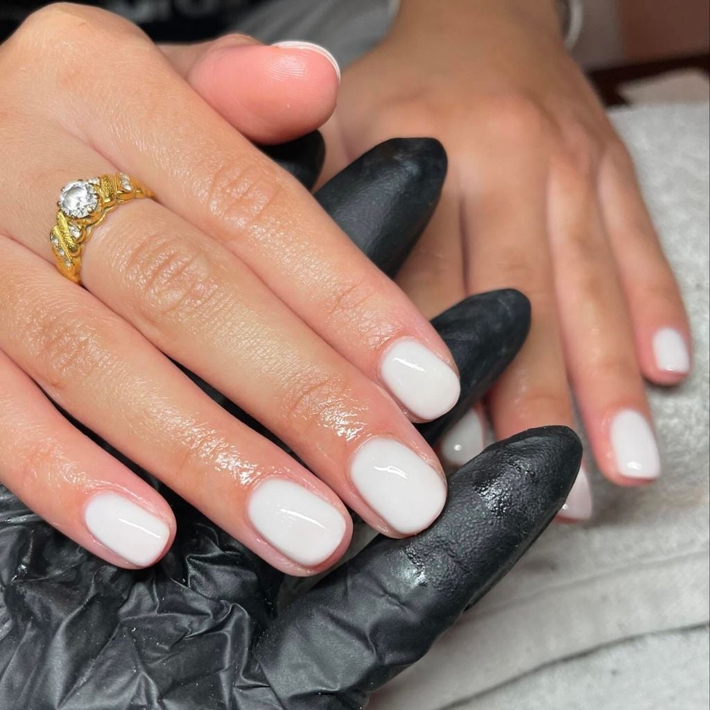 Short Oval Milky White Opaque Nails, Resting On Black Gloves — Nails for White Dress