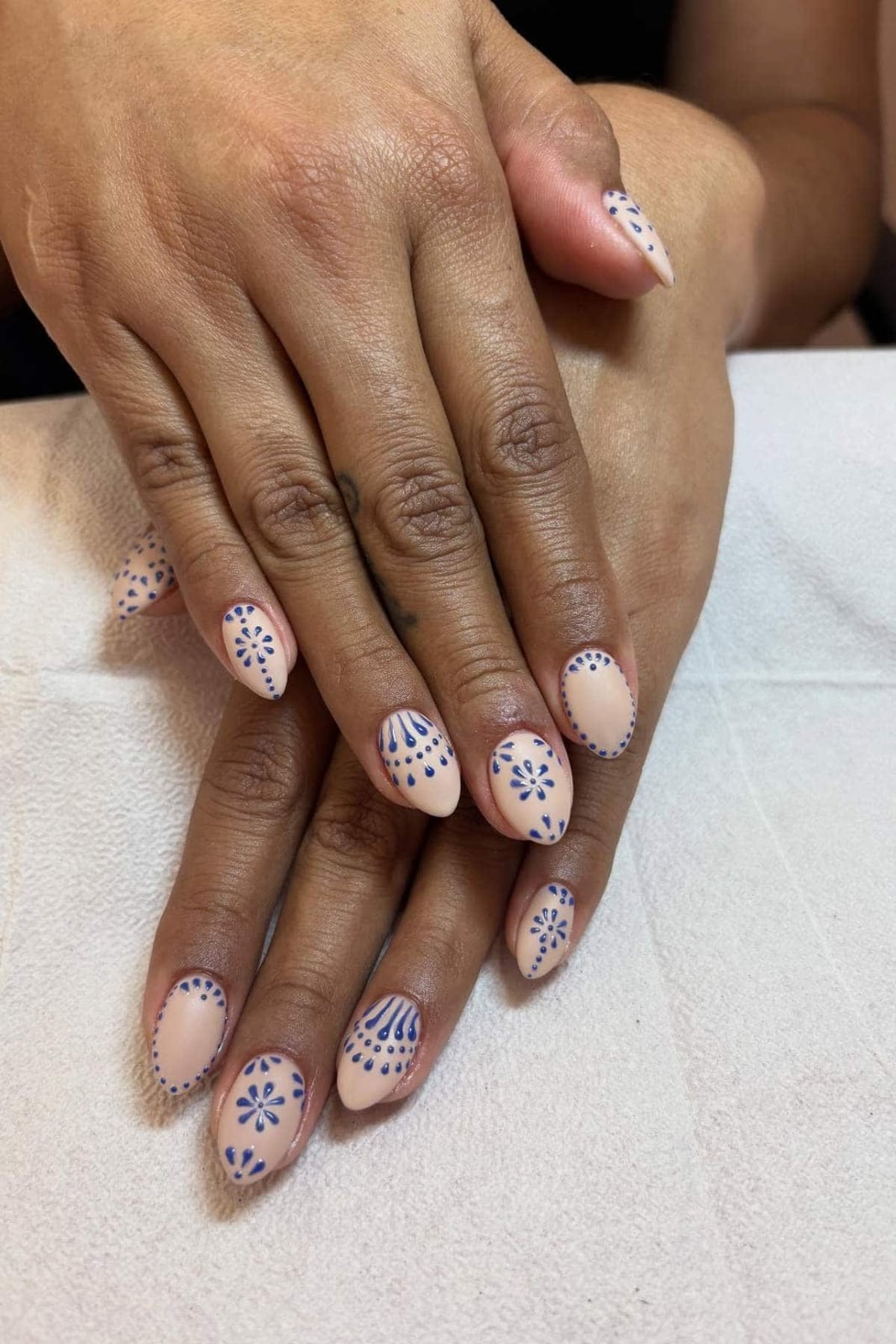 Short Almond Nude Blue Floral Motif Nails Short Almond Nude Blue Floral Motif Nails — Nails for Women Over 40