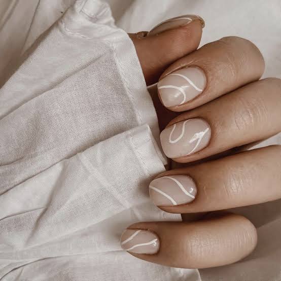 Sheer Nude Glossy Short Oval Nails with White Wavy Lines — Nails for Women Over 50