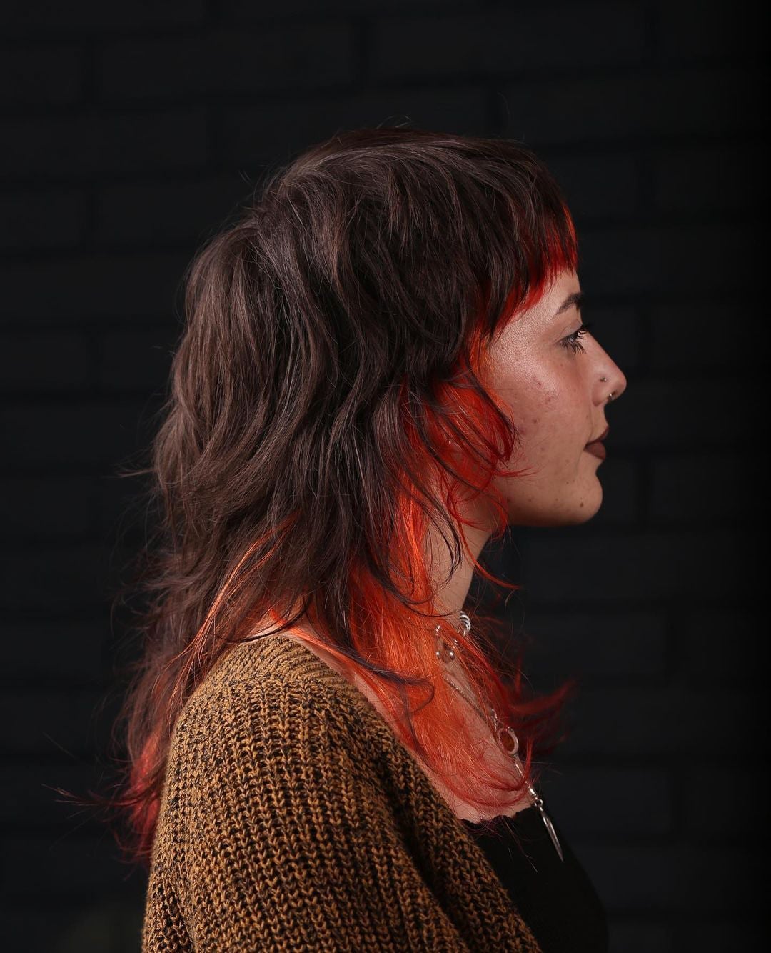 Collarbone Octopus With Choppy Bangs And Orange Streaks Collarbone Octopus With Choppy Bangs And Orange Streaks — Octopus Haircut