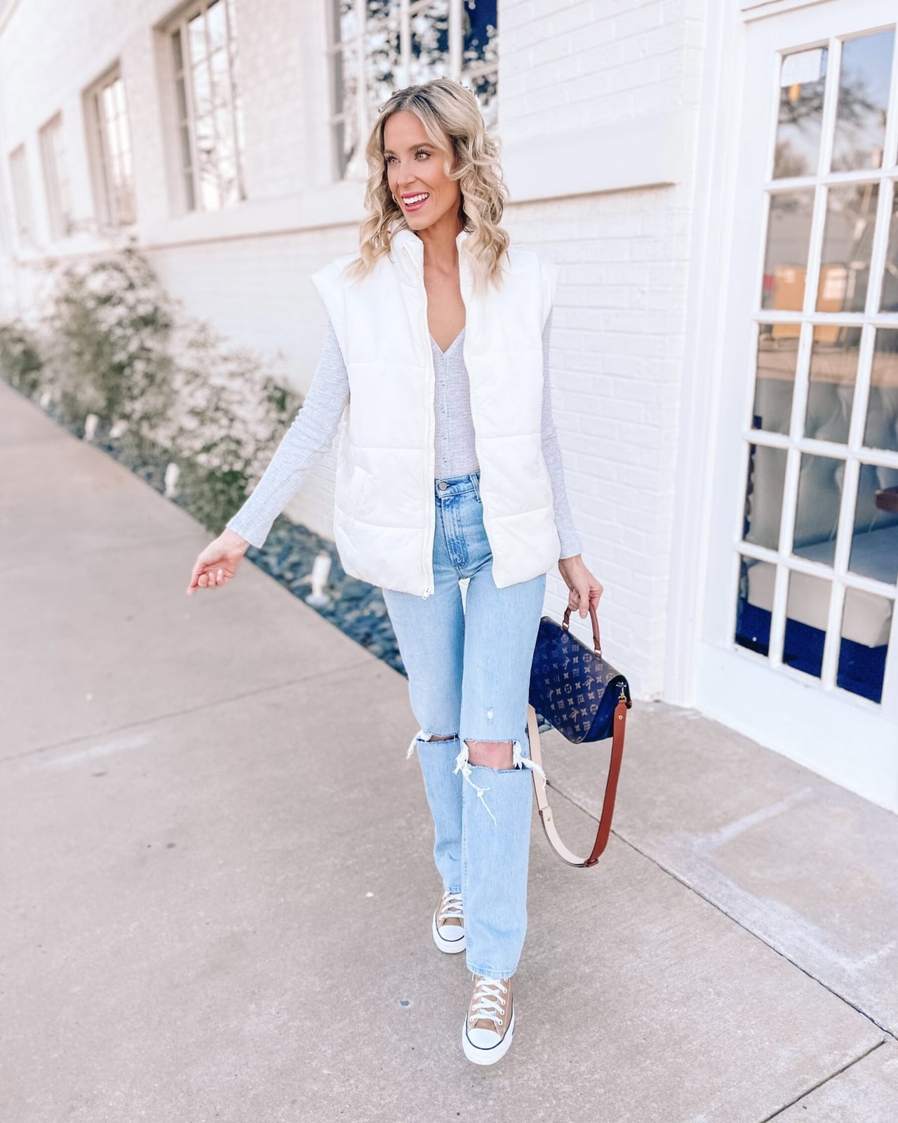 White Puffer Vest With Ripped Jeans — Puffer Vest Outfits