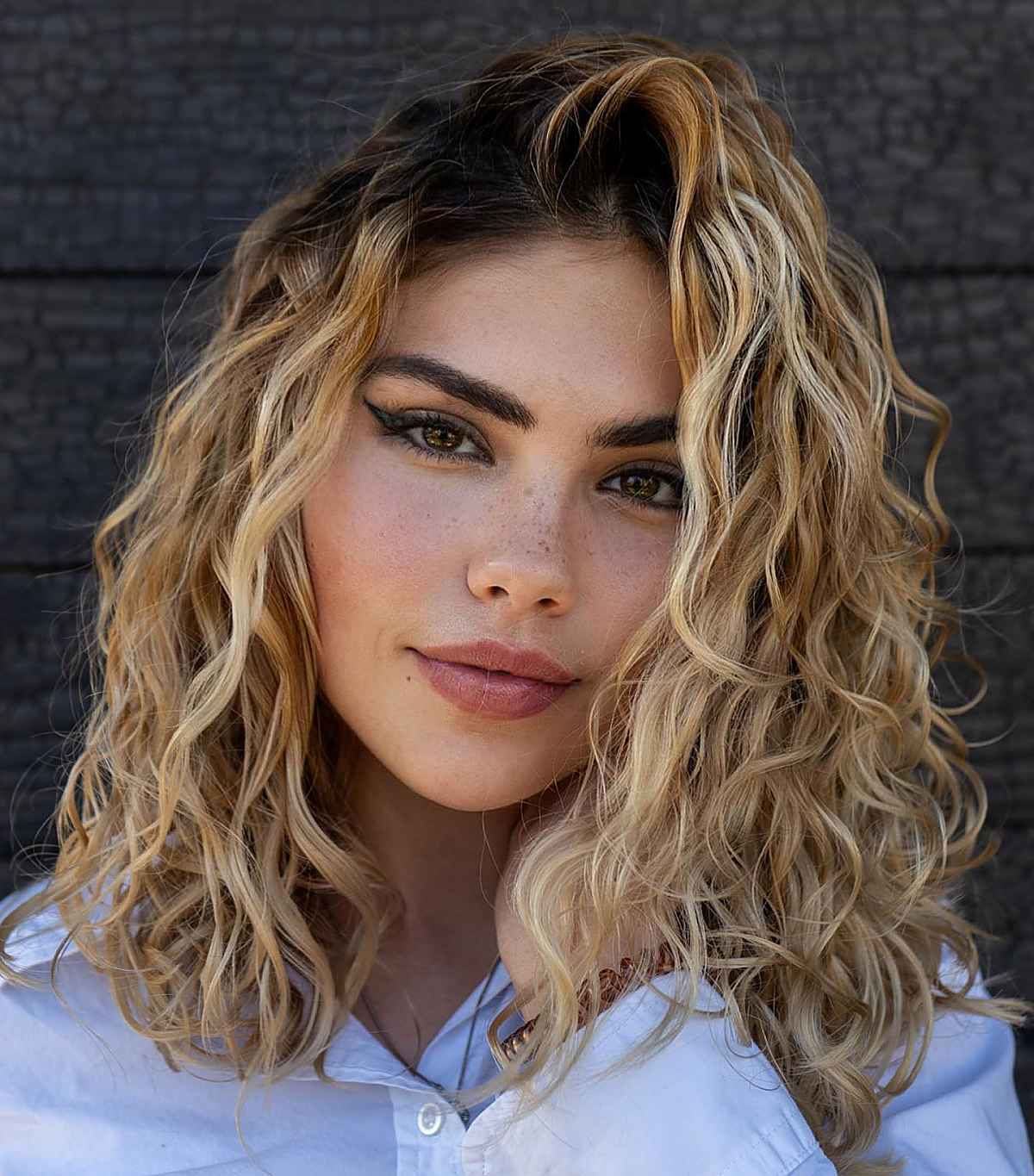 Collarbone Rooted Dirty Blonde With Curls Collarbone Rooted Dirty Blonde With Curls — Rooted Blonde