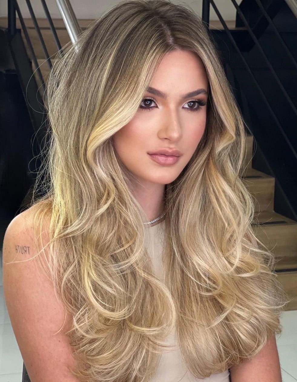Mid-Back Golden Blonde Balayage With Dark Roots, Long Layers Mid-Back Golden Blonde Balayage With Dark Roots, Long Layers — Rooted Blonde