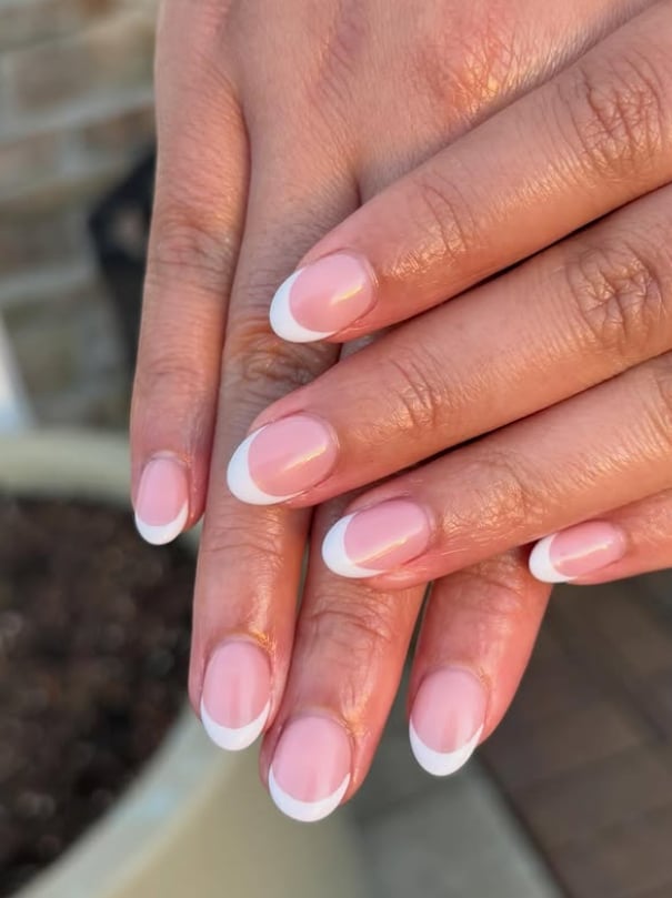 Sheer Pink Base White Tip Glossy Round Nails, Close-Up Take Sheer Pink Base White Tip Glossy Round Nails, Close-Up Take