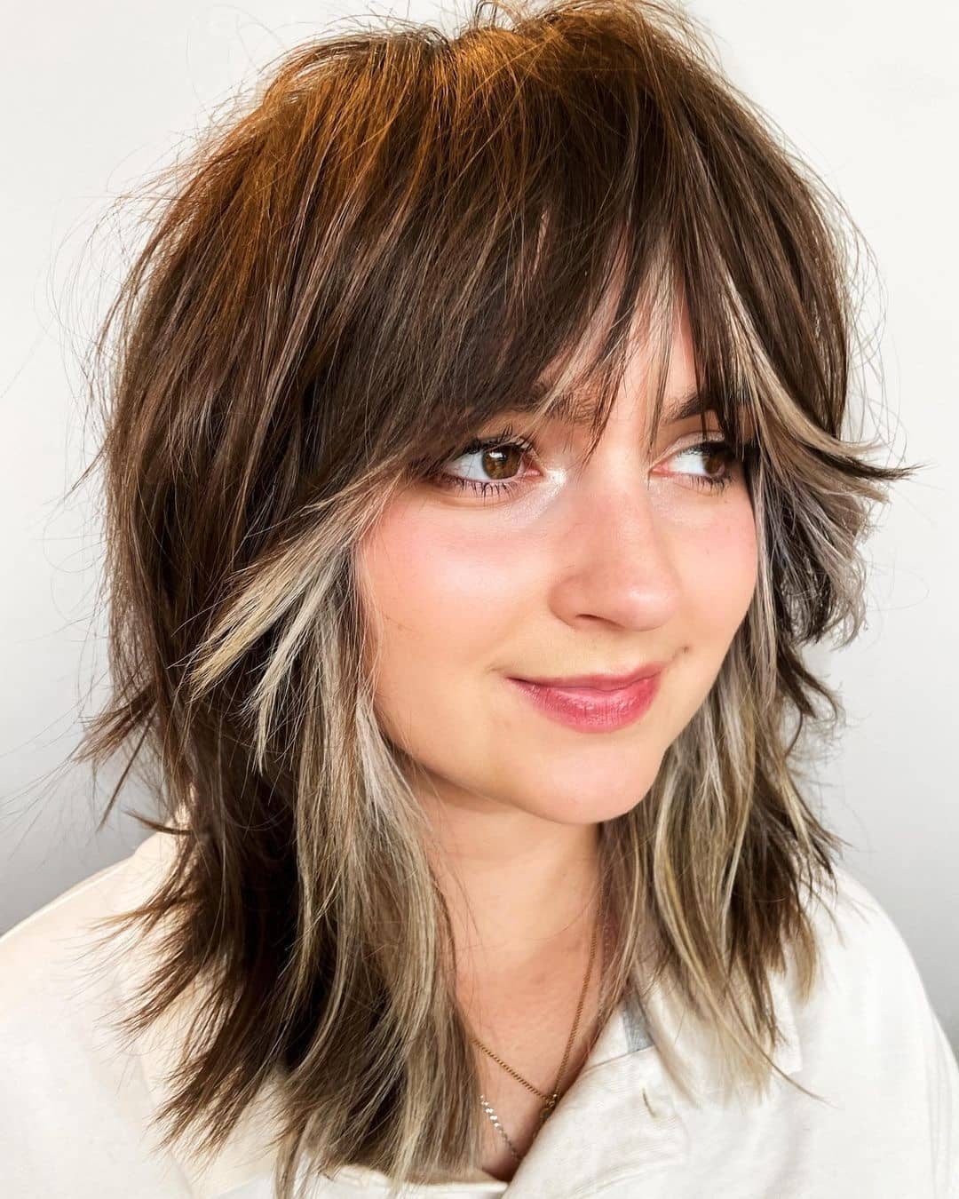 Shoulder Shag With Blonde Money Piece — Shag Haircut