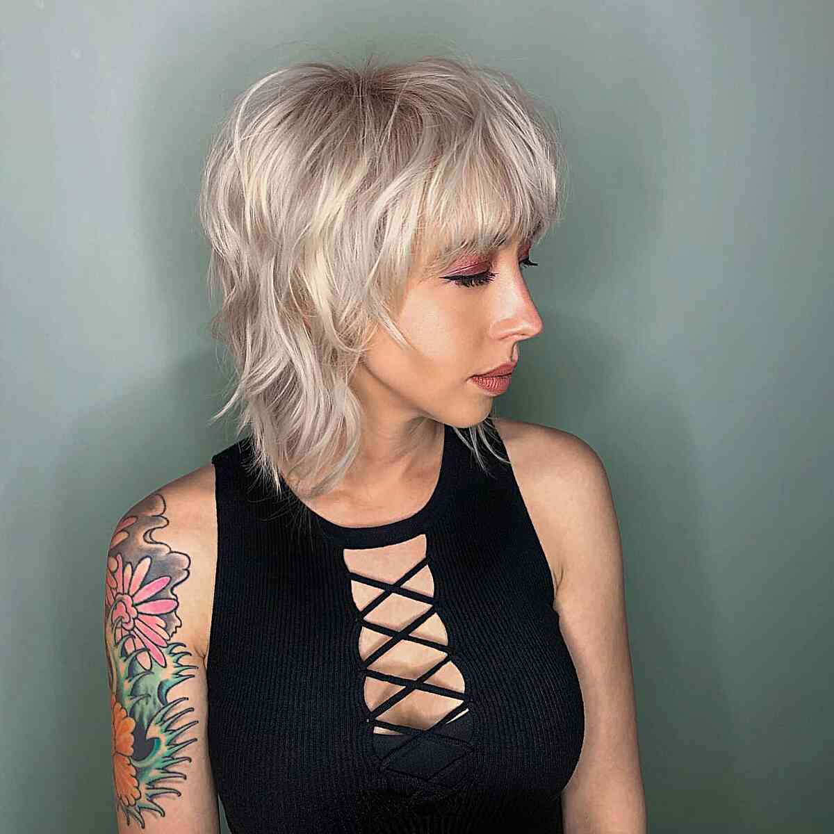 Short Platinum Blonde Shag With Choppy Bangs — Shag Haircut