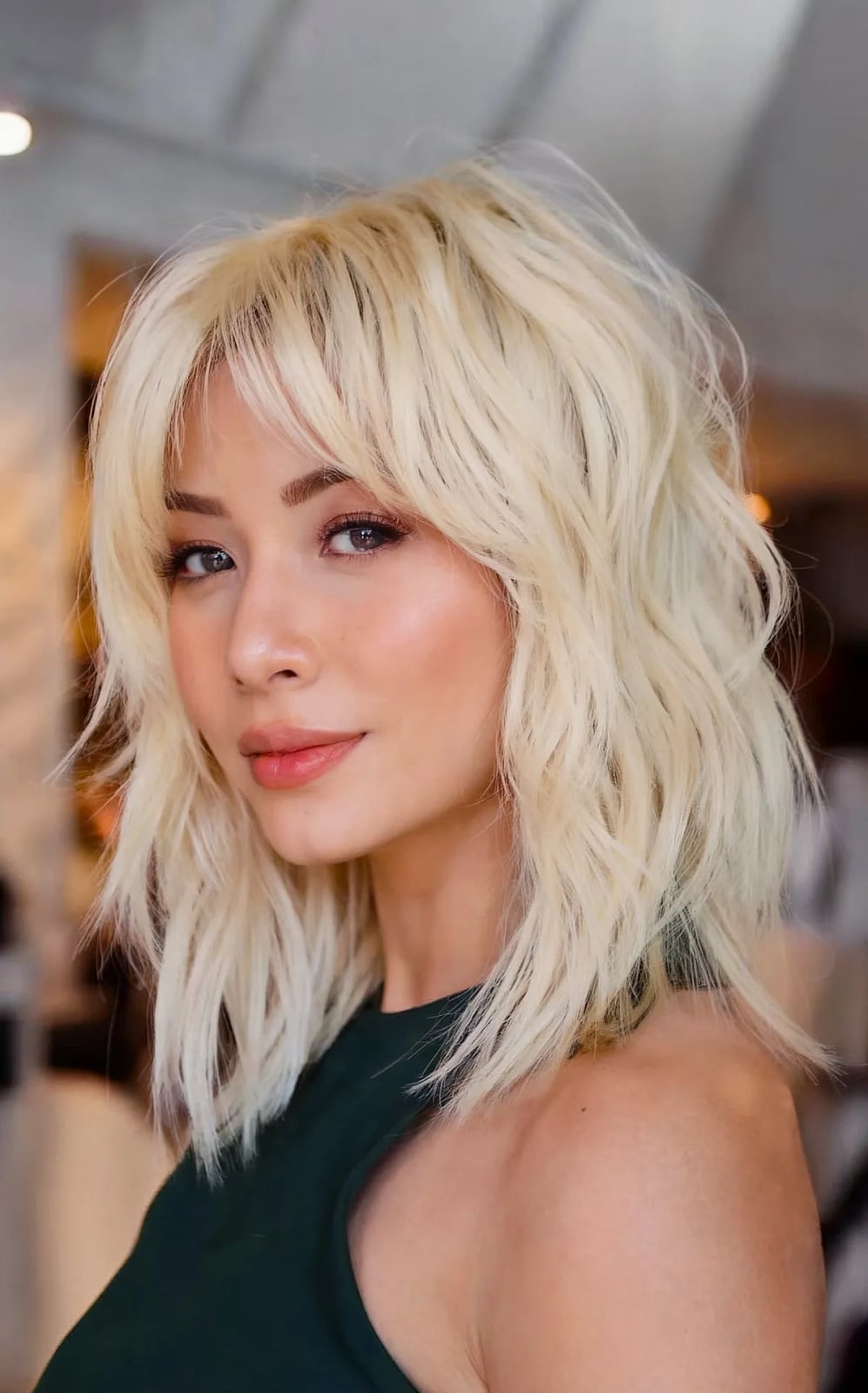 Collarbone Ash Blonde Shag With Side-Swept Bangs Collarbone Ash Blonde Shag With Side-Swept Bangs — Shag with Curtain Bangs