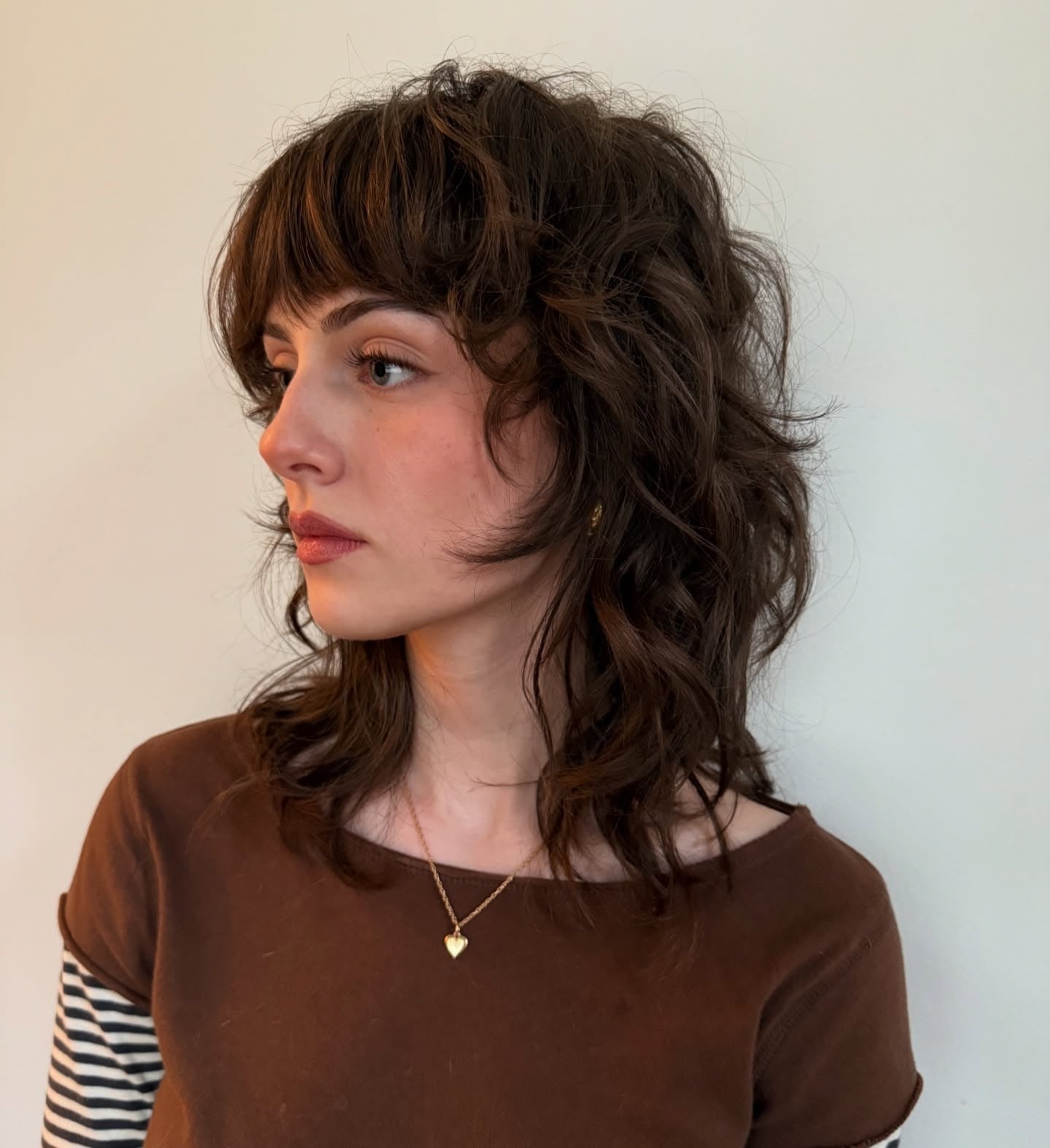 Collarbone Dark Brown Shag With Choppy Layers Collarbone Dark Brown Shag With Choppy Layers — Shag with Curtain Bangs