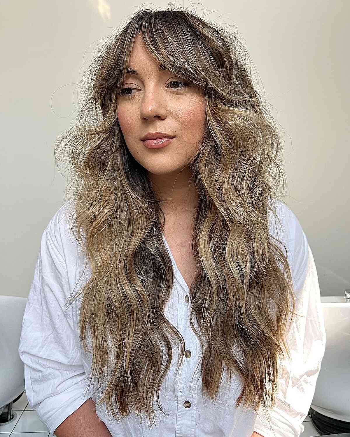 Mid-Back Dark Blonde Shag With Loose Waves Mid-Back Dark Blonde Shag With Loose Waves — Shag with Curtain Bangs