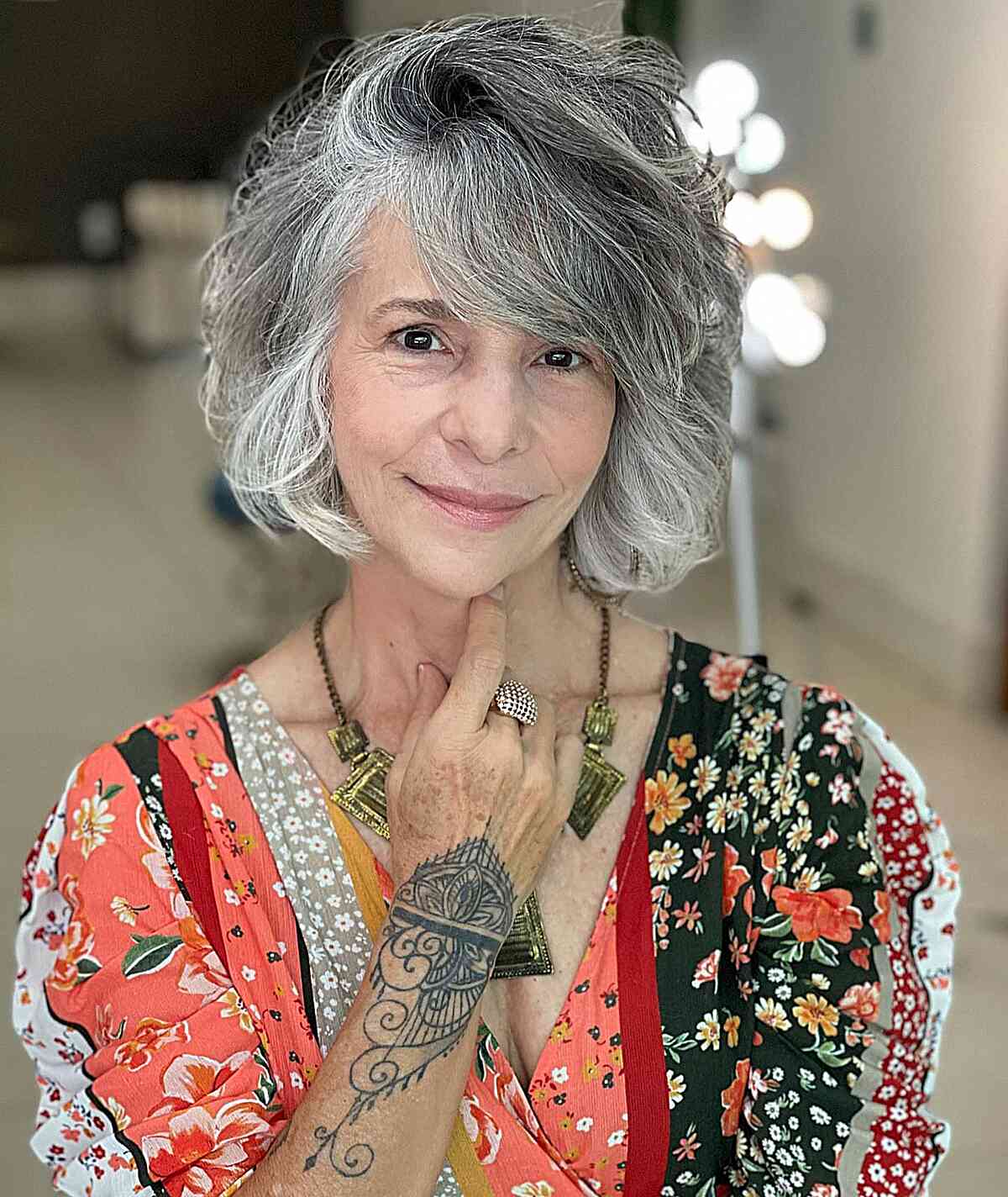 Gray Bob With Voluminous Waves Curtain Bangs — Short Bob