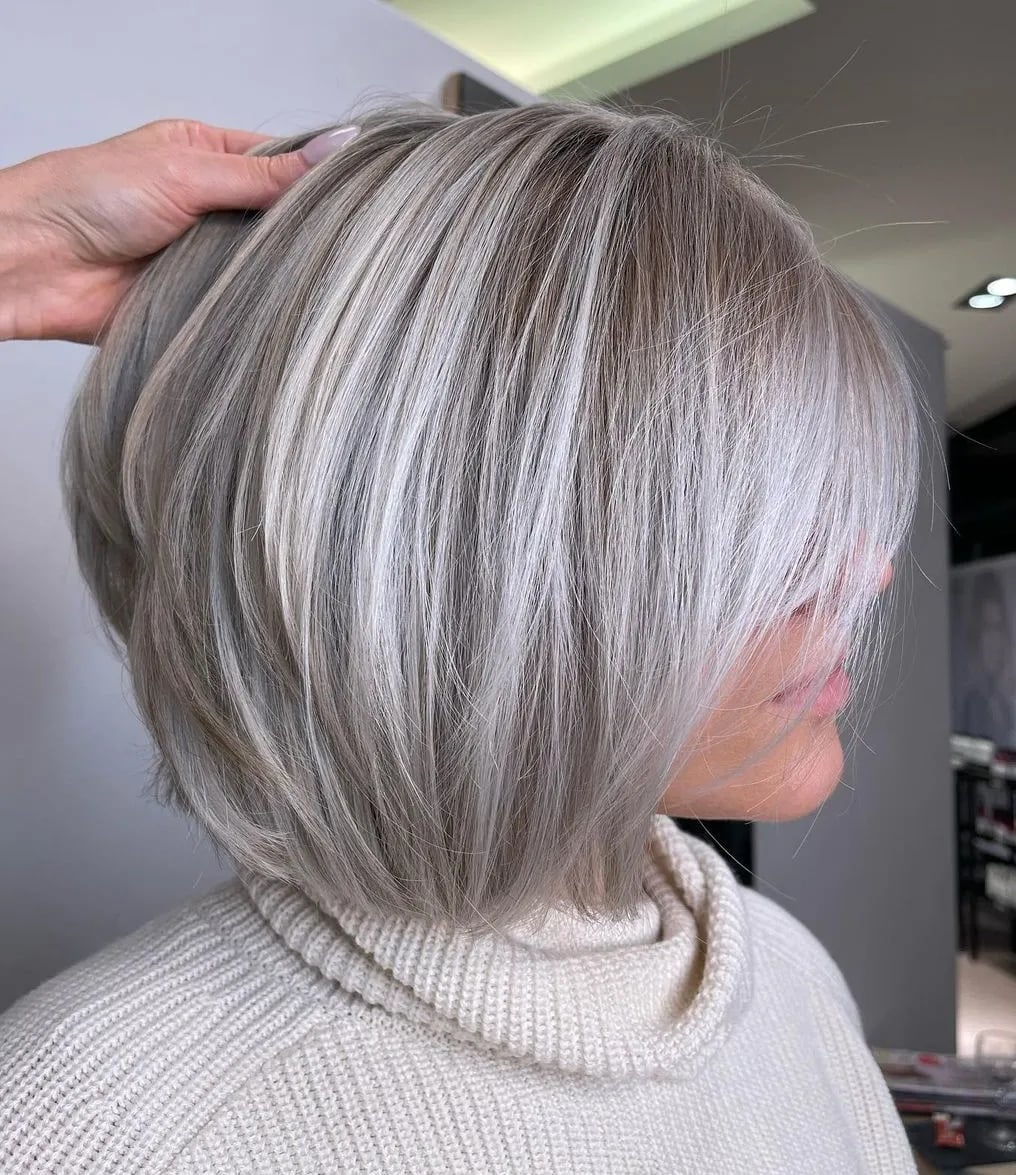 Chin Length Silver Bob With Blonde Highlights, Close-Up Take Chin Length Silver Bob With Blonde Highlights, Close-Up Take
