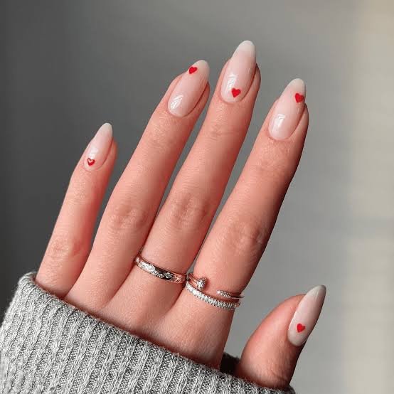 Medium Almond Sheer Nude With Tiny Red Hearts — Simple Nails