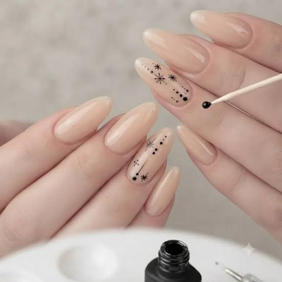 Medium Almond Sheer Nude With Black Constellation Art — Simple Nails