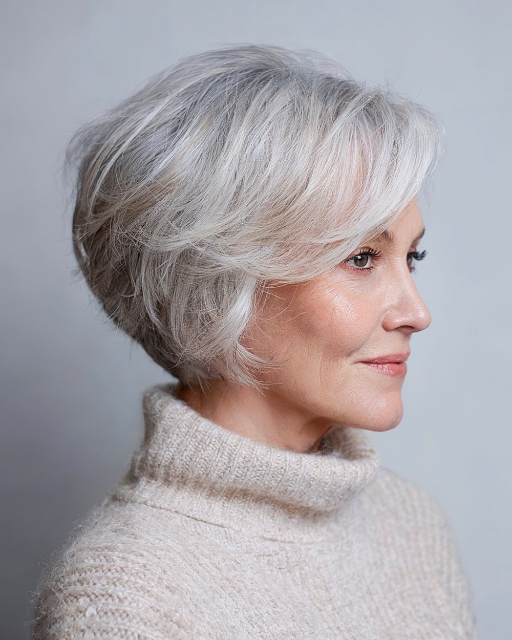 Gray Blonde Stacked Bob With Side Swept Fringe, Ear