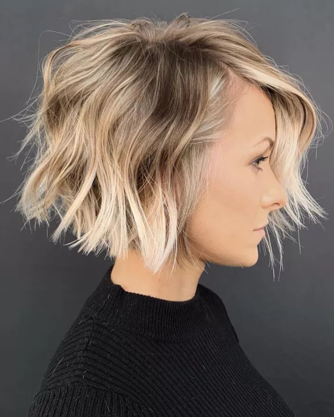 Chin Length Ash Blonde Choppy Bob With Side Swept Bangs Chin Length Ash Blonde Choppy Bob With Side Swept Bangs — Textured Bob
