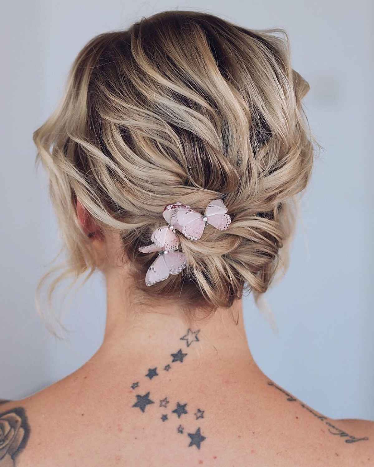 Blonde Bob Twisted Updo With Butterfly Accessory — Updos for Short Hair