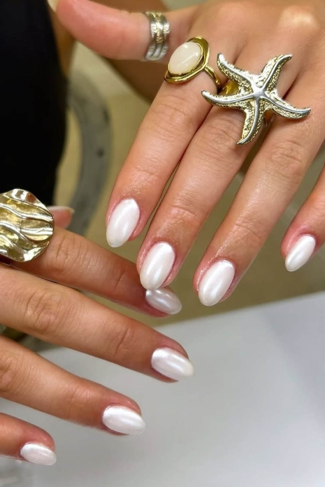 Milky White Chrome Shimmer Short Almond Hands — White Nails
