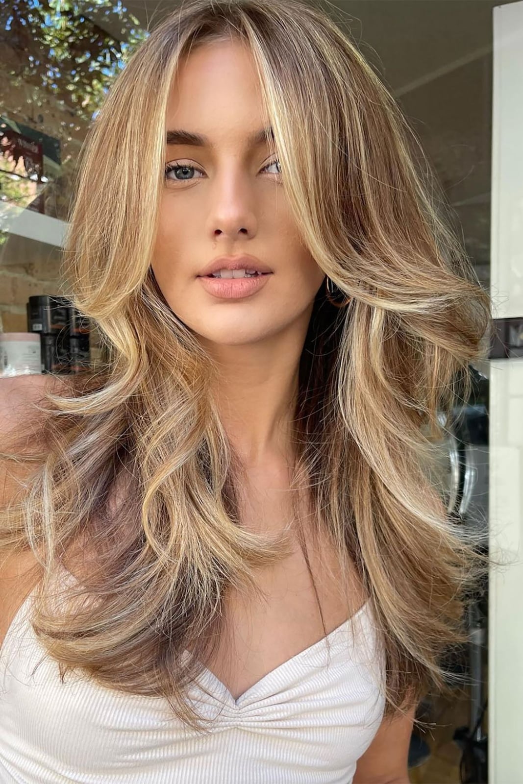 Mid-Back Layers With Curtain Bangs and Highlights Mid-Back Layers With Curtain Bangs and Highlights — Winter Haircuts for Women