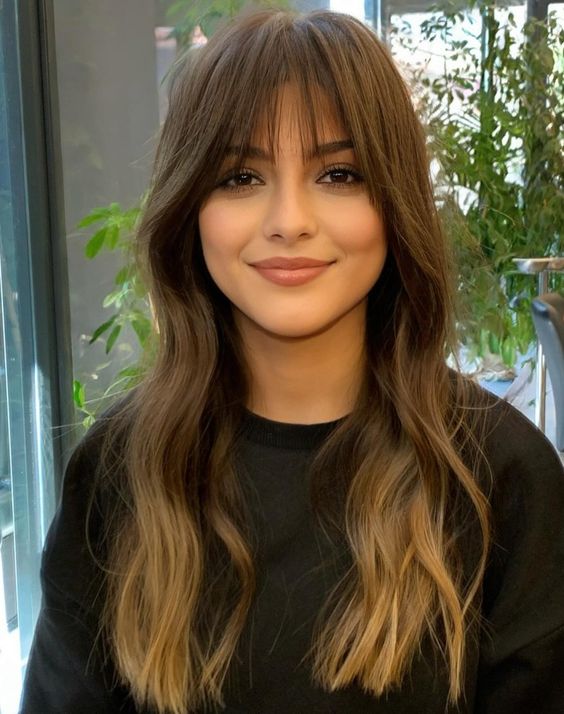 Mid-Back Layers With Loose Waves And Wispy Bangs Mid-Back Layers With Loose Waves And Wispy Bangs