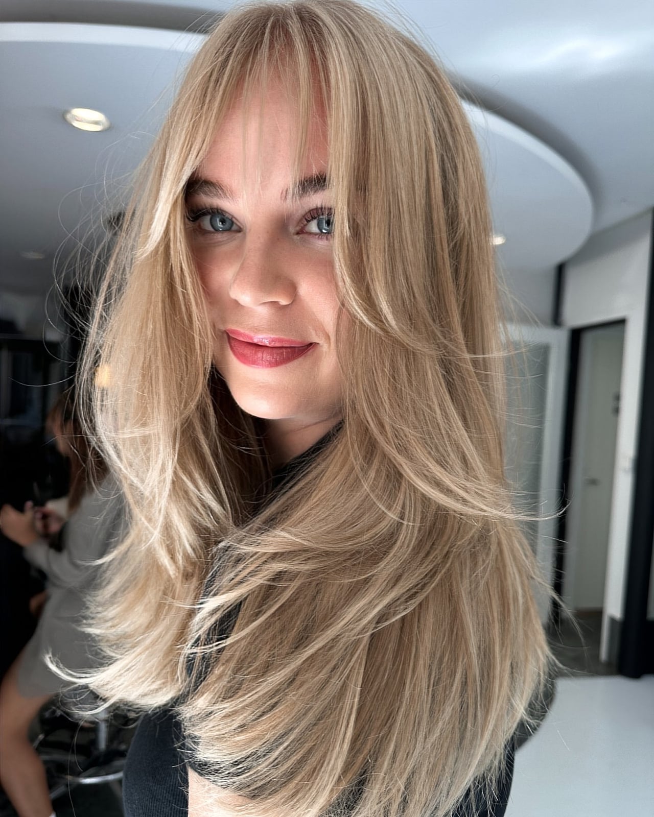 Ash Blonde Mid-Back Layers With Wispy Bangs Ash Blonde Mid-Back Layers With Wispy Bangs