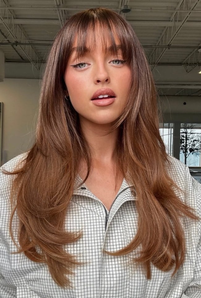 Caramel Brown Mid-Back Layers With Wispy Bangs Caramel Brown Mid-Back Layers With Wispy Bangs